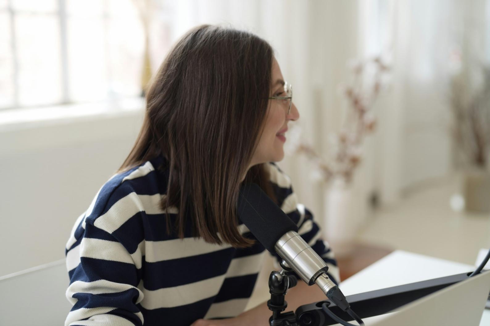 Students recording a community sports radio segment in a studio